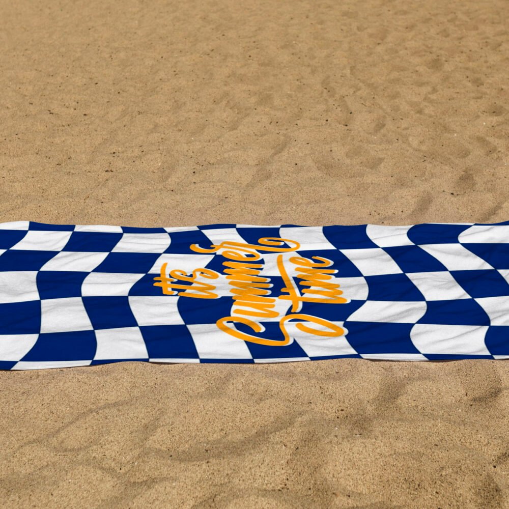 white beach towel psd mockup laying on the sand