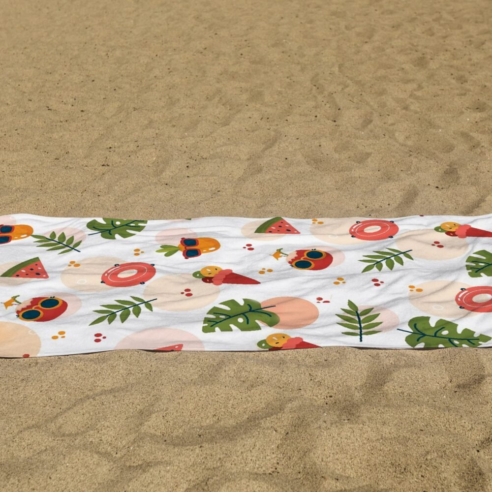 white beach towel psd mockup laying on the sand